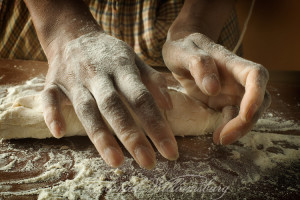 Gene Mitchell's hands kneading dough